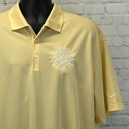 Nike Golf Polo in light yellow with embroidered tree logo on the chest, front view