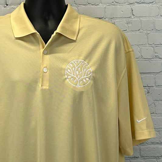Nike Golf Polo in light yellow with embroidered tree logo on the chest, front view