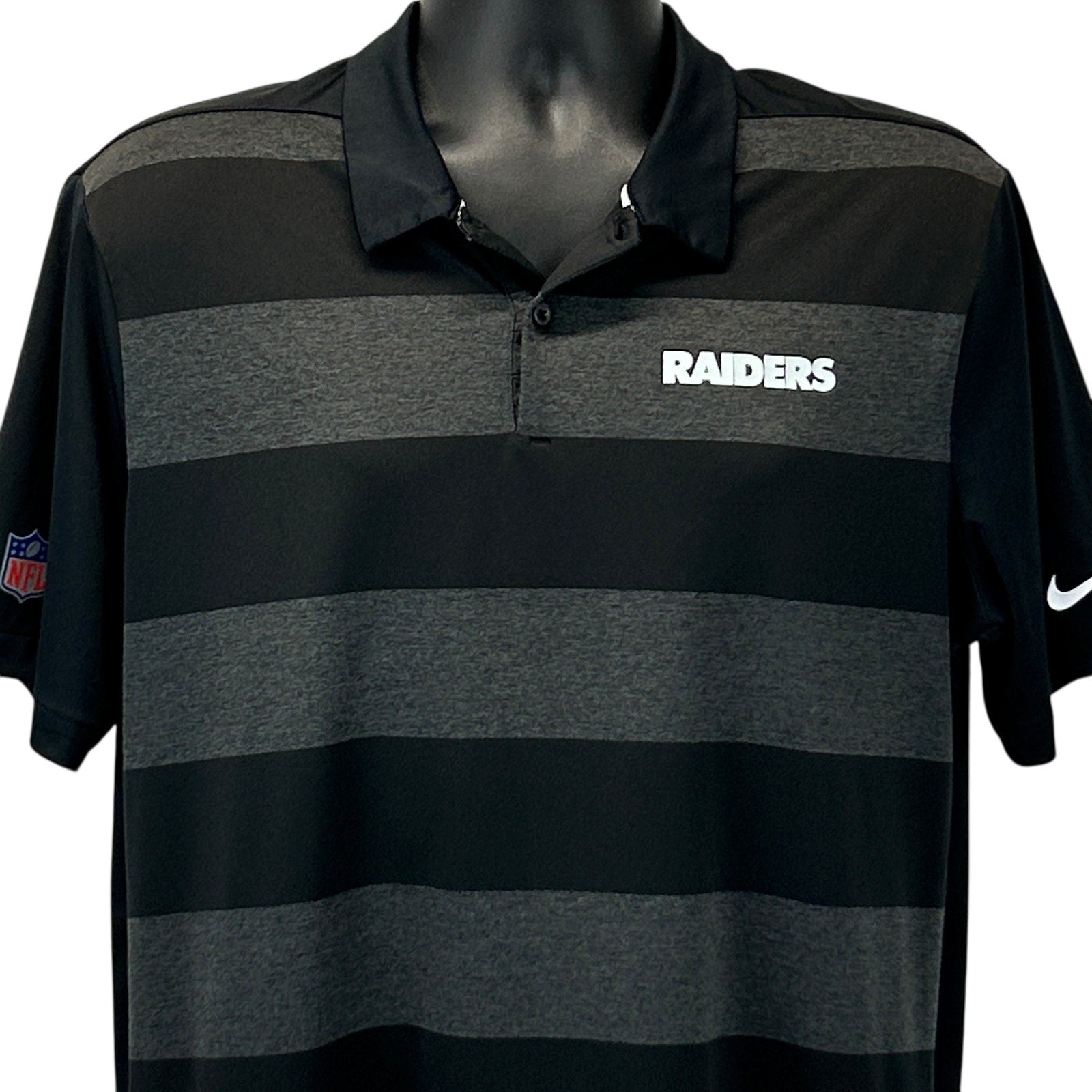 Nike Raiders Polo in black and gray stripes with front logo, perfect for fans and casual wear.