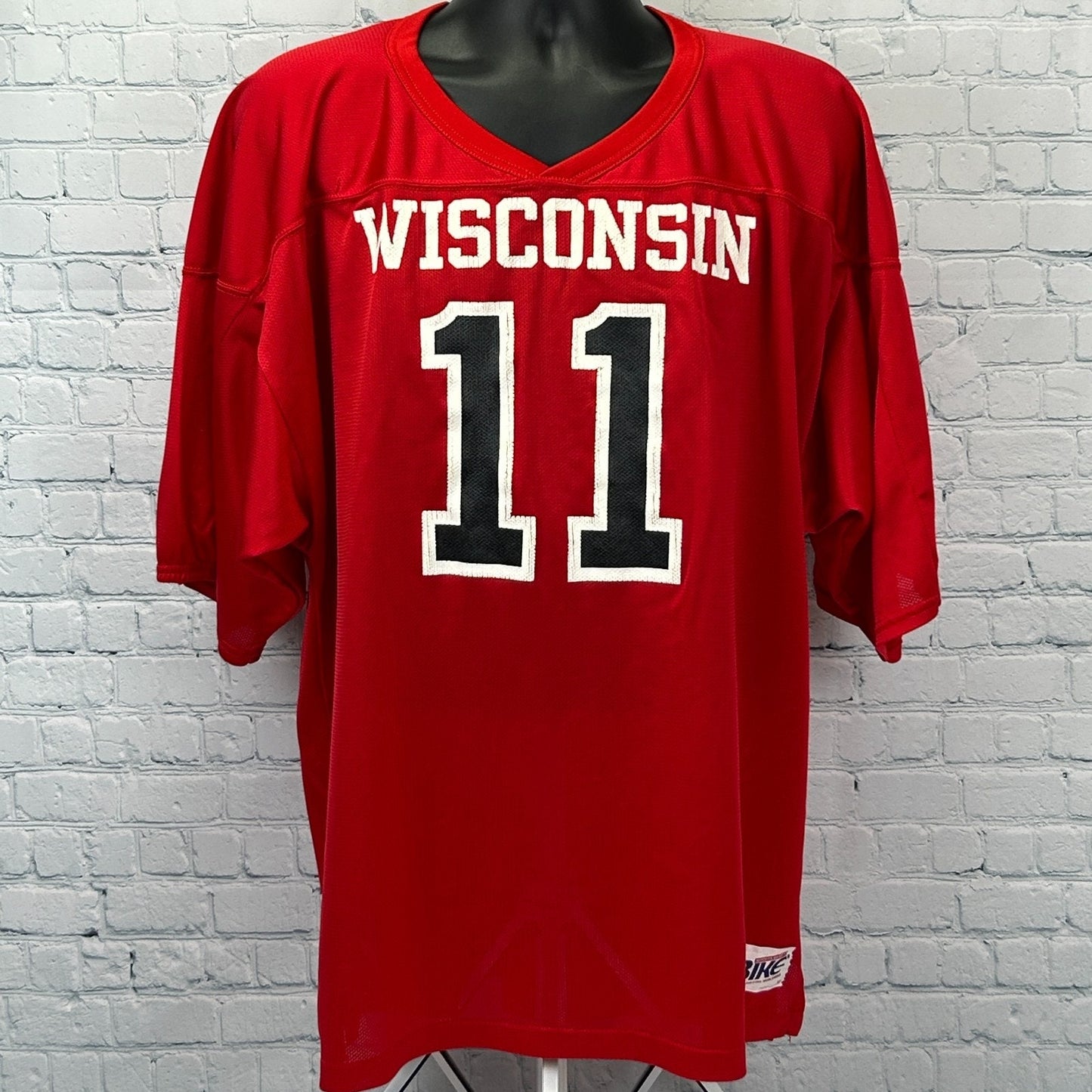 Wisconsin Badgers Jersey in red with number 11 on the front, featuring bold lettering and classic design