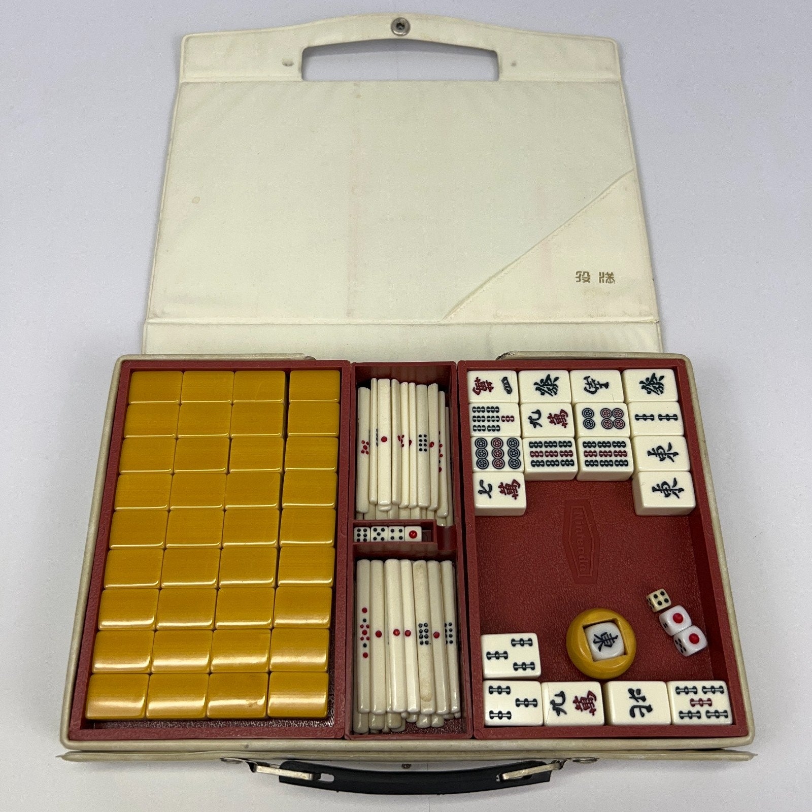 Nintendo Japanese Mahjong Set in a white case, featuring yellow tiles, red details, and dice