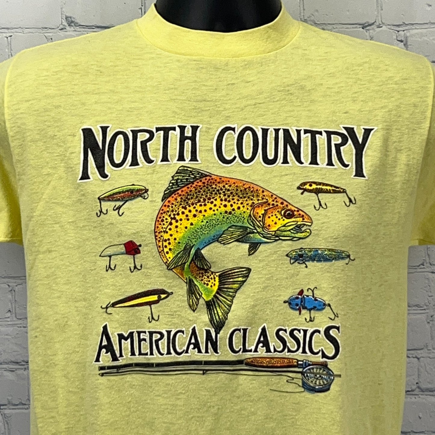 Yellow Fishing T-shirt featuring trout graphic and lures, front view, from Vintage American Classics collection