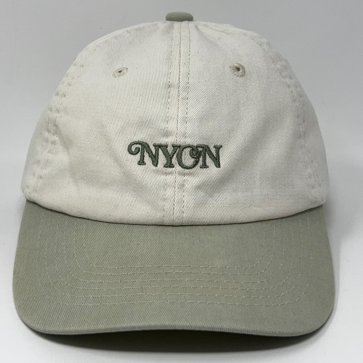 NYON New York Or Nowhere Baseball Cap in cream with green embroidery and adjustable strap