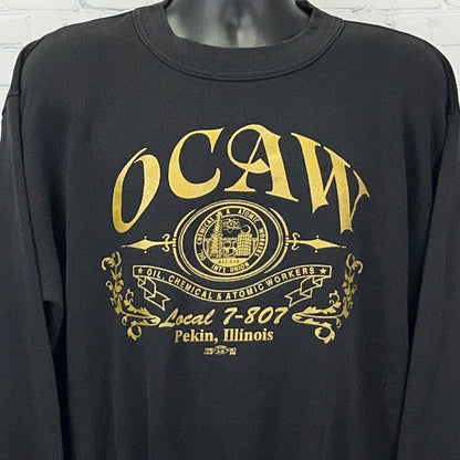 Black long-sleeve shirt featuring OCAW logo and Local 7-807 text, front view with detailed design