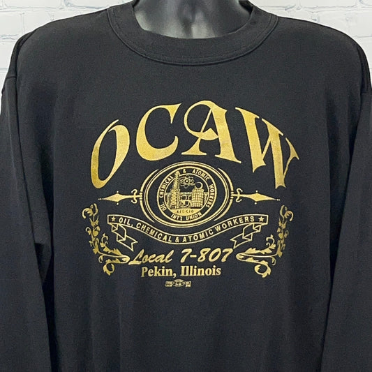 Black long-sleeve shirt featuring OCAW logo and Local 7-807 text, front view with detailed design