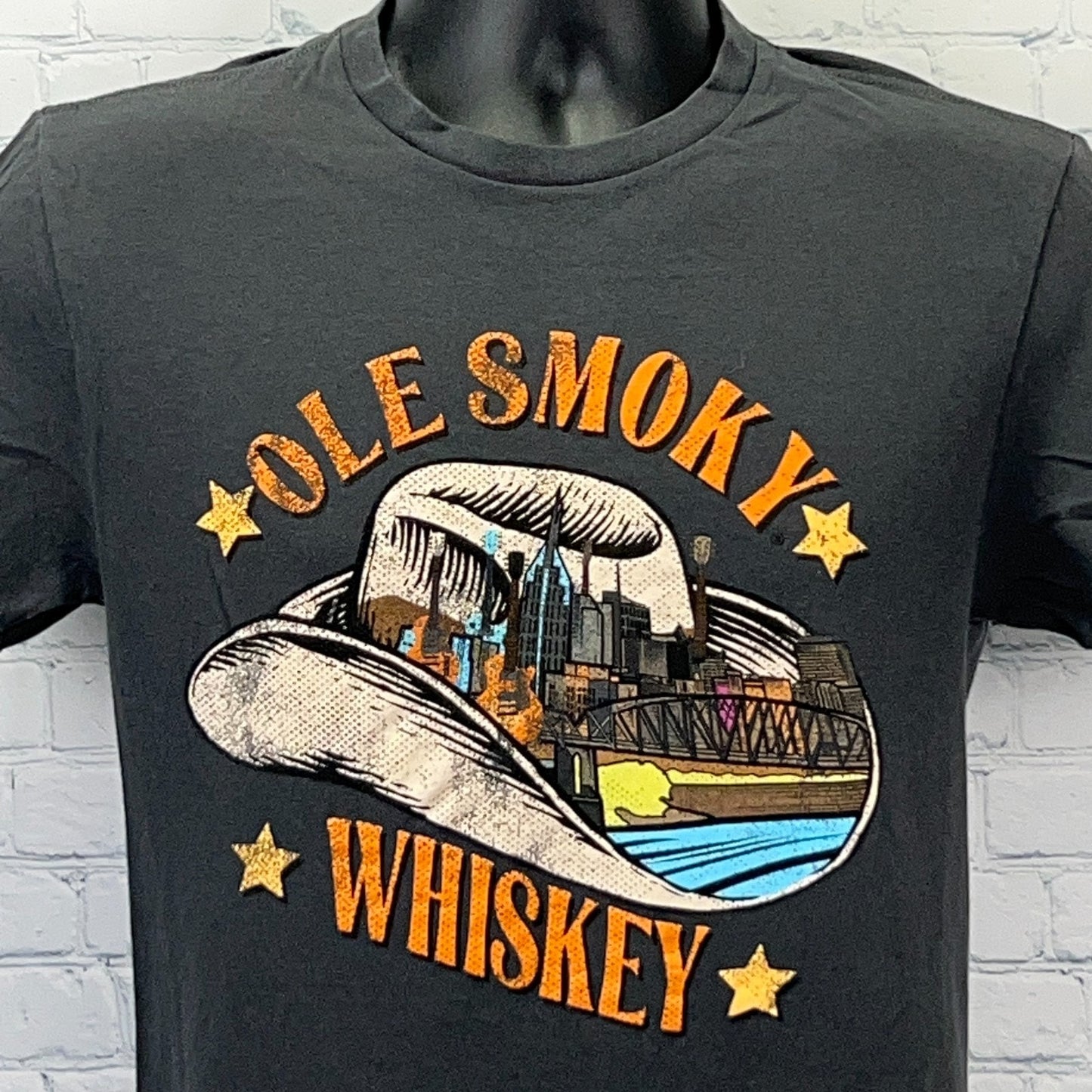Black t-shirt featuring colorful Ole Smoky Whiskey graphic with a cowboy hat design