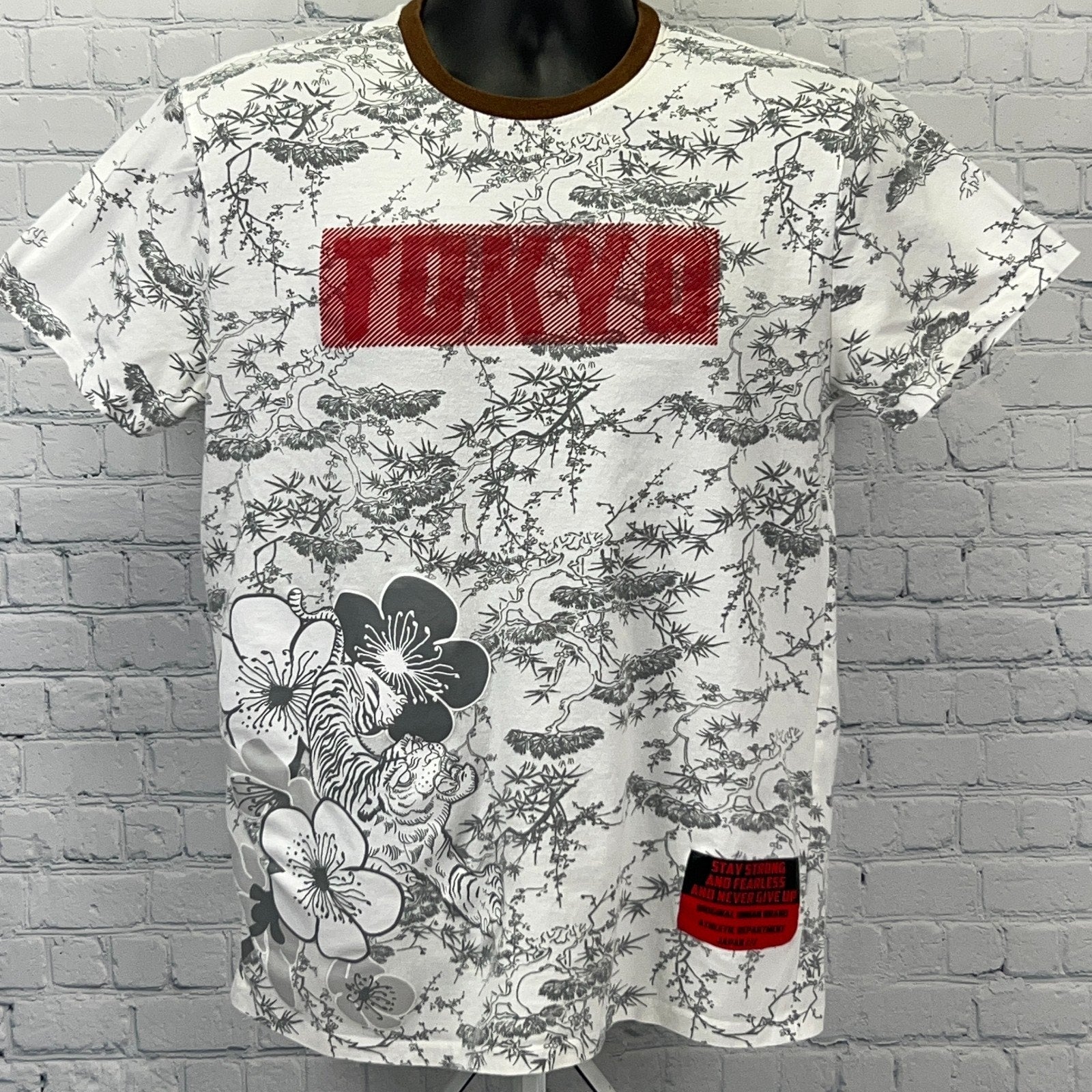 Original Gravity Tokyo white graphic t-shirt featuring floral prints and red Tokyo logo on front