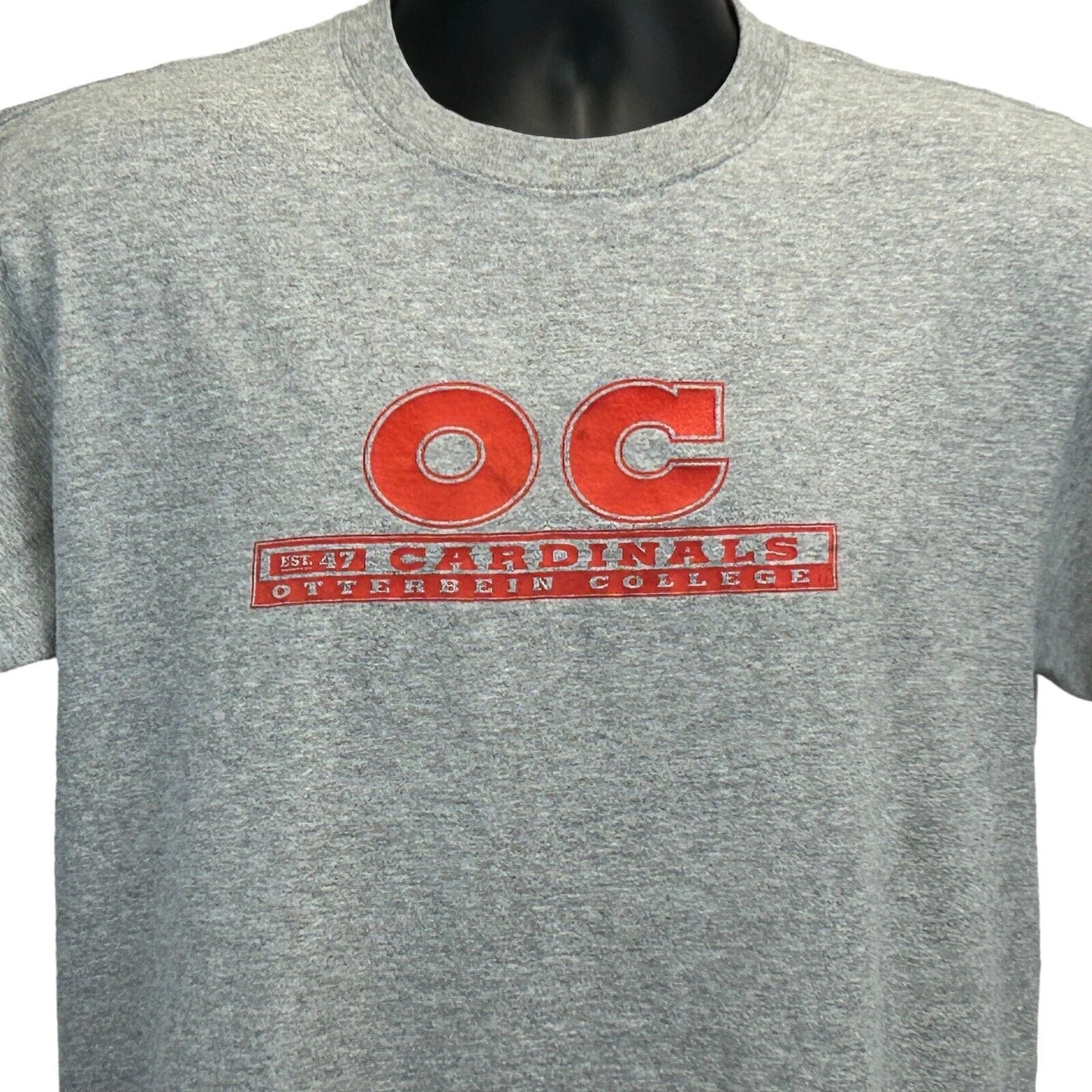 Gray MV Sport T-Shirt featuring Otterbein University logo in red, size medium, front view