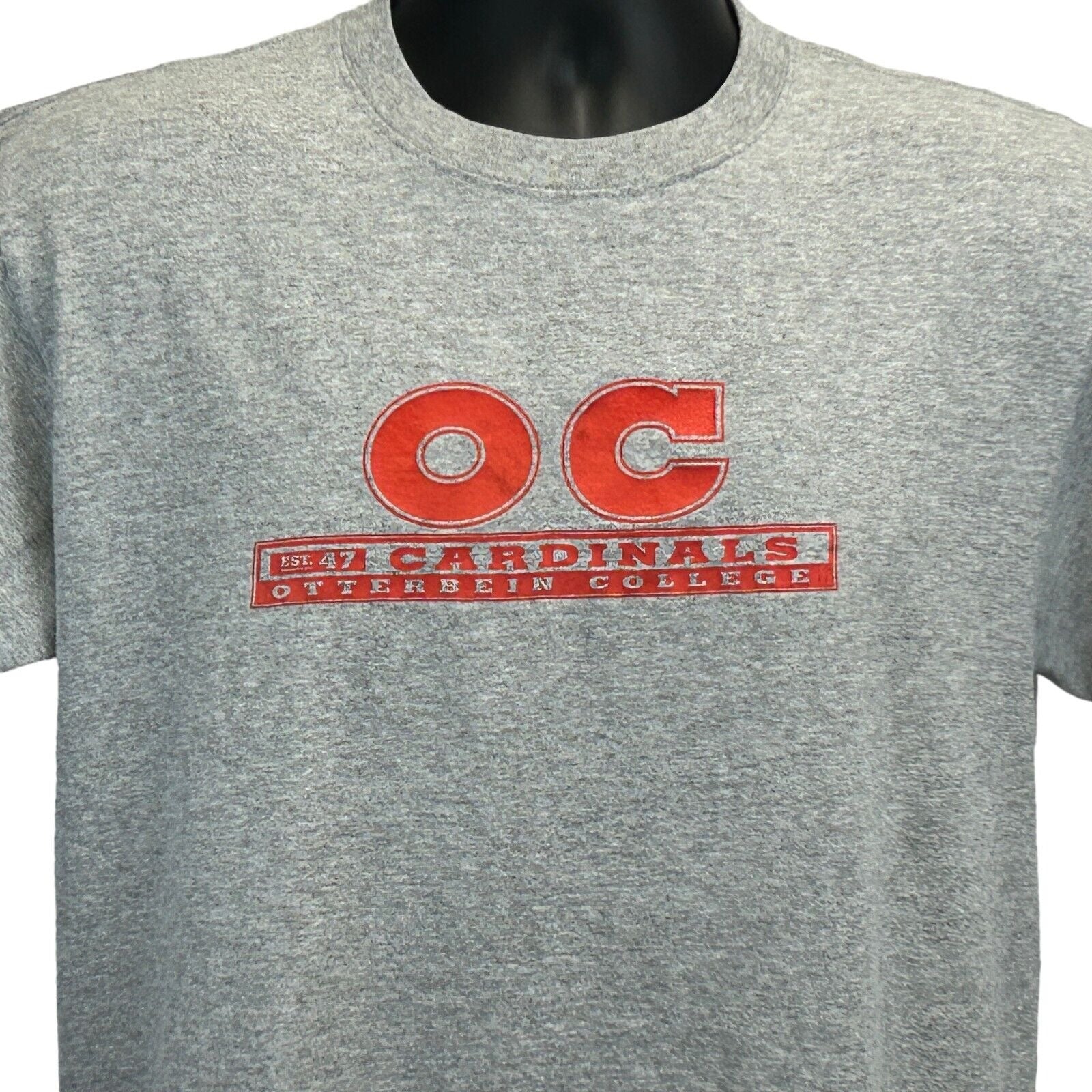 Gray MV Sport T-Shirt featuring Otterbein University logo in red, size medium, front view