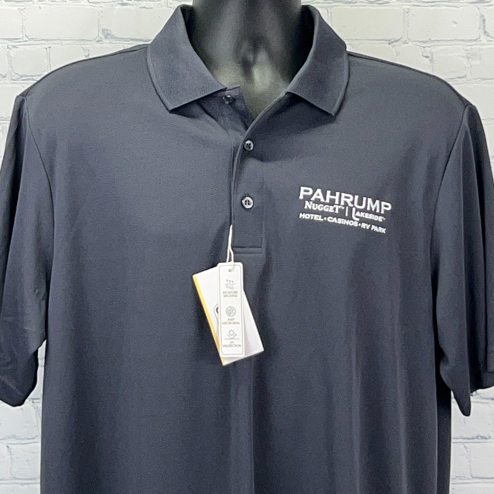 Dark gray Pahrump polo shirt with collar and logo from Pahrump Nugget Hotel-Casino-RV Park