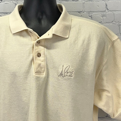 Beige polo shirt from Paris Las Vegas with Eiffel Tower logo on the chest, front view