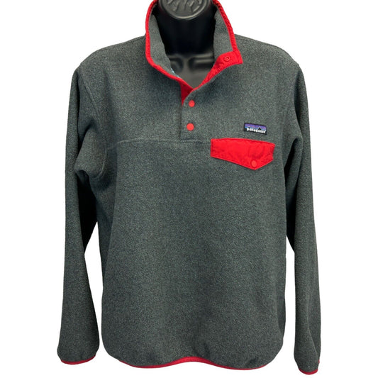 Patagonia gray fleece jacket with red pocket and collar, front view highlighting logo detail