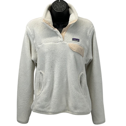 Patagonia fleece jacket in cream color with a front pocket and logo on the chest, size medium, front view