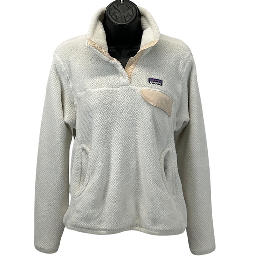 Patagonia fleece jacket in cream color with a front pocket and logo on the chest, size medium, front view