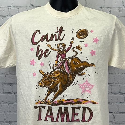Cream PBR Professional Bull Riders T-shirt with graphic of a cowgirl taming a bull