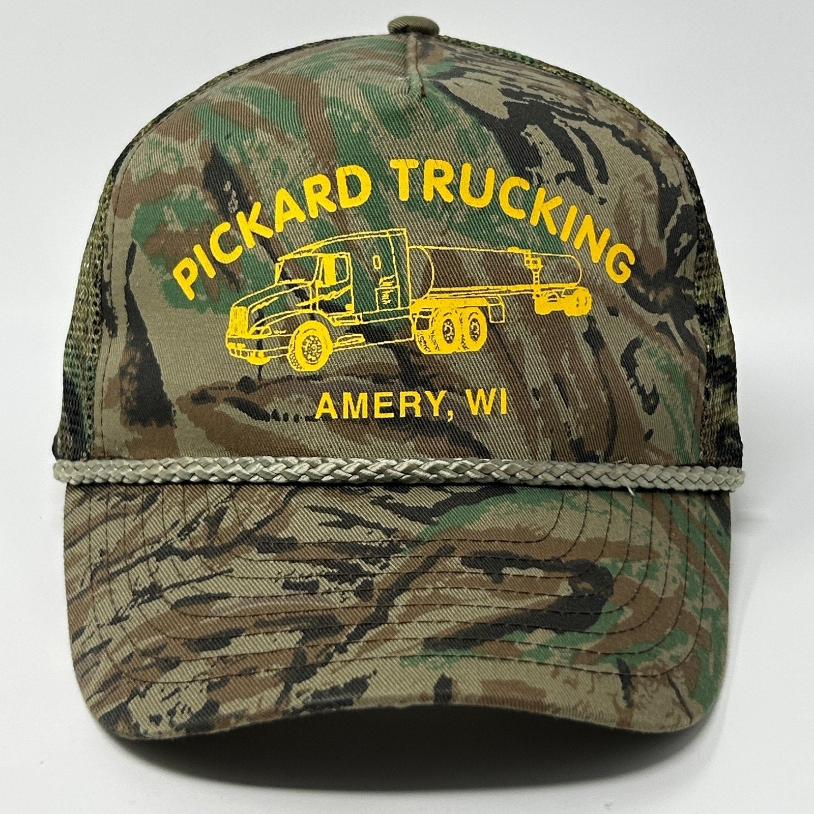 Vintage Trucker Hat in camo with yellow Pickard Trucking logo and truck design, front view