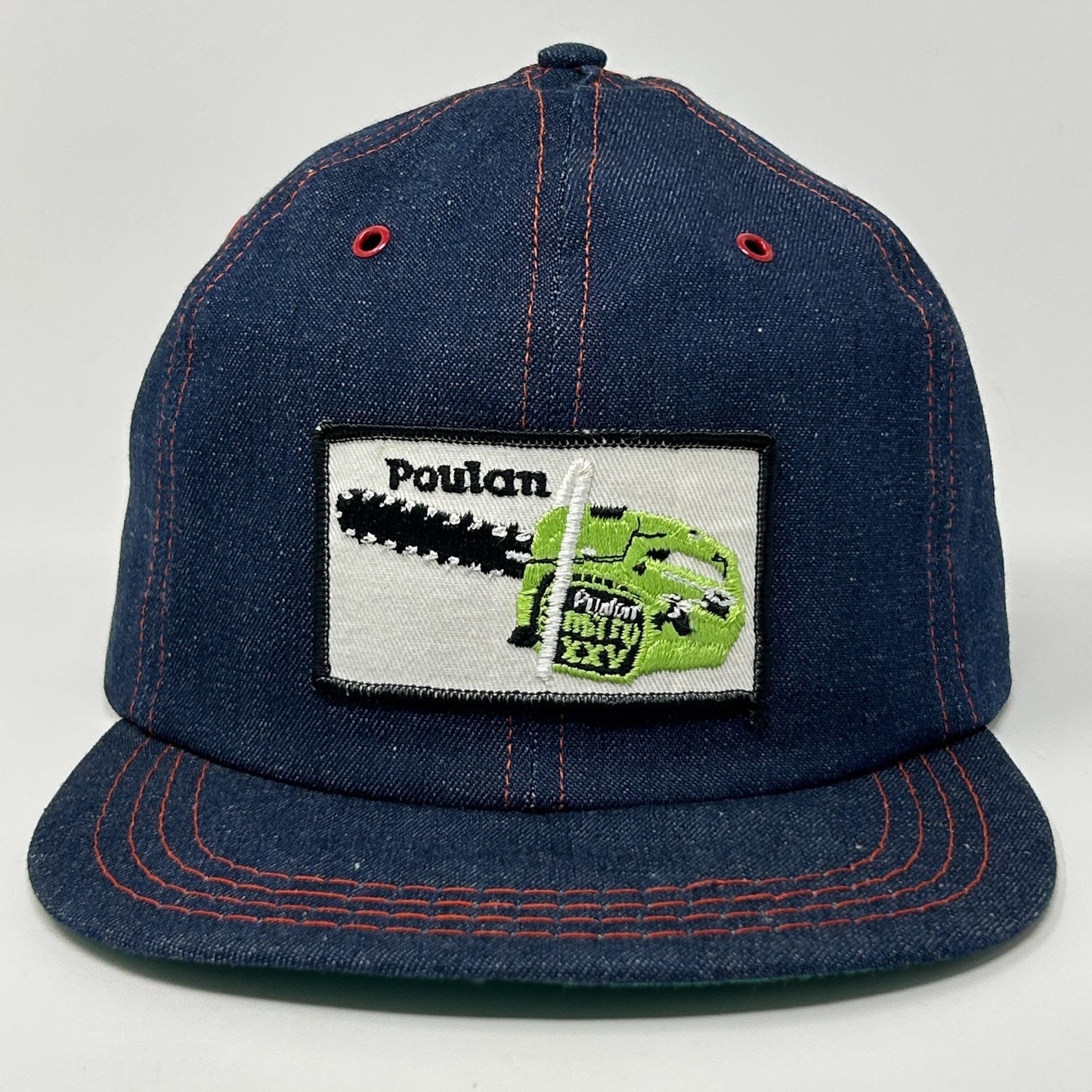 Vintage Poulan Baseball Cap Hat with green chainsaw logo on front, denim fabric and adjustable fit