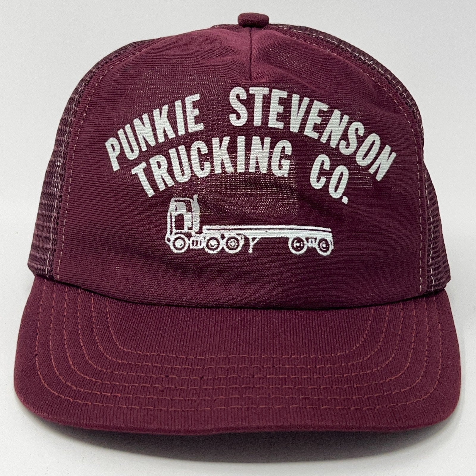 Maroon Vintage Trucker Hat featuring Punkie Stevenson Trucking Co logo on the front