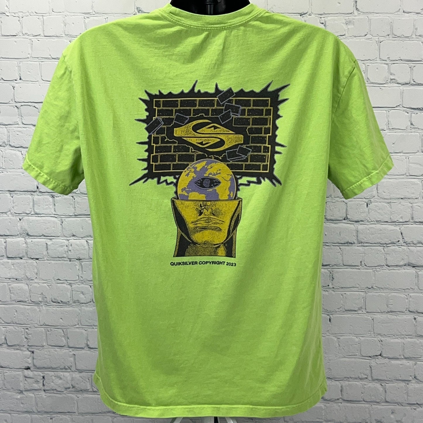 Quiksilver Green Graphic T-Shirt featuring a unique back design with a head and logo