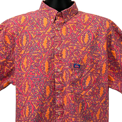 Front view of Quiksilver short-sleeve shirt in vibrant orange and pink geometric pattern