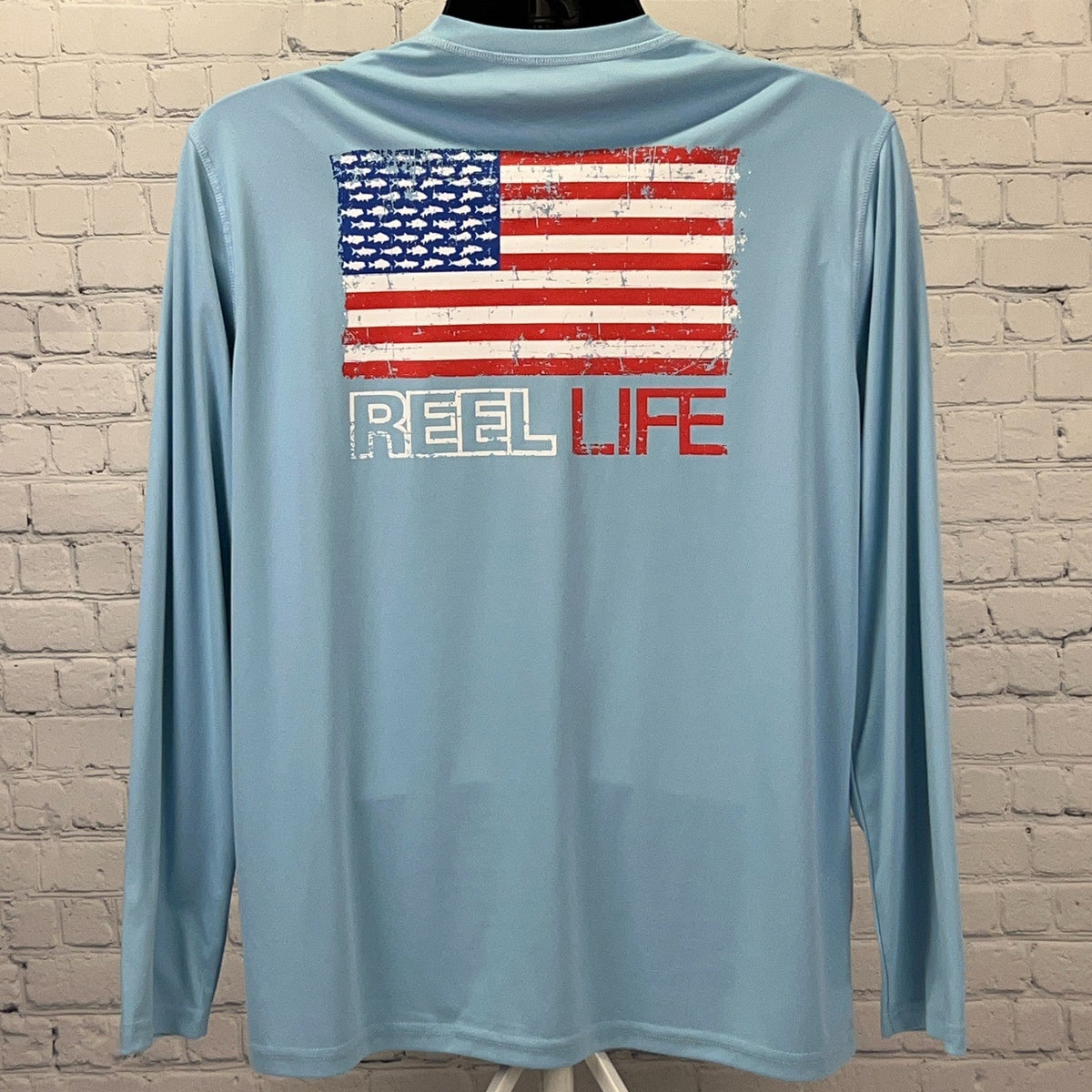 Reel Life Fishing Long Sleeve Shirt in Light Blue with American Flag Graphic on Back