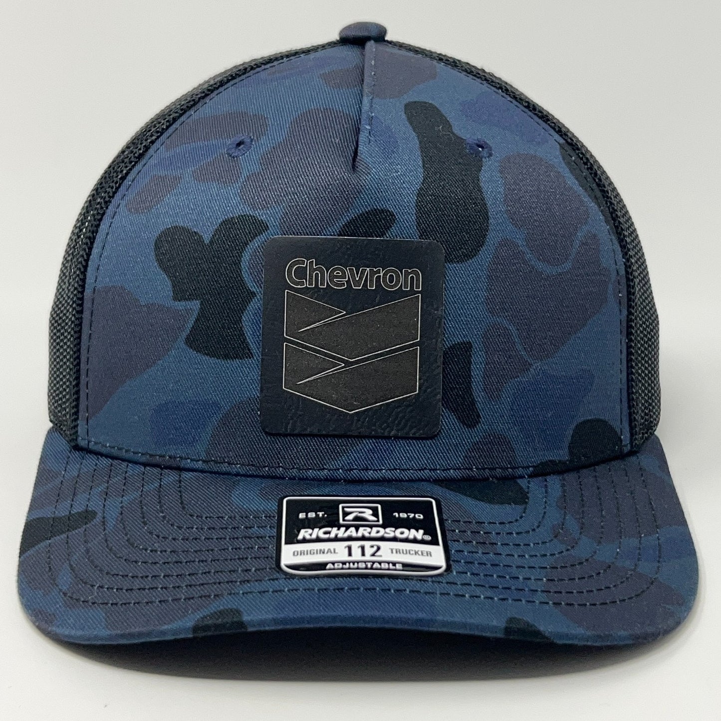 Richardson adjustable trucker cap in navy camo with black Chevron logo on the front