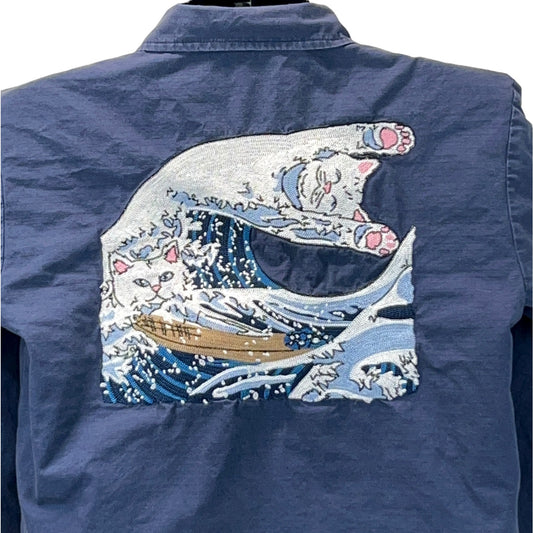Ripndip shirt in navy blue featuring a detailed embroidered cat surfing on waves, back view