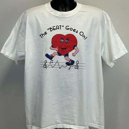 White Gildan T-Shirt with Riverview Cardiac logo featuring a cartoon heart running and musical notes