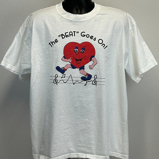 White Gildan T-Shirt with Riverview Cardiac logo featuring a cartoon heart running and musical notes