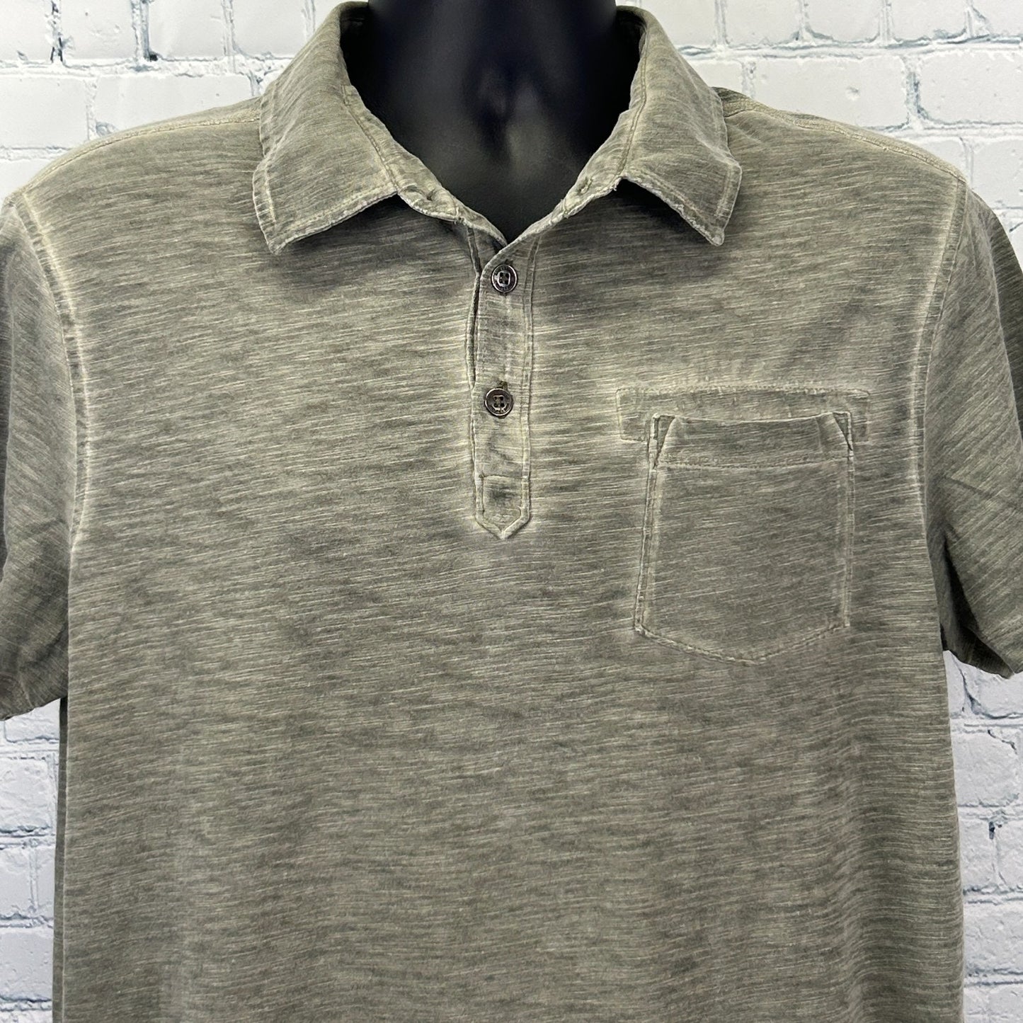 Rock & Republic Polo in olive green, featuring a front pocket and button collar, viewed from the front
