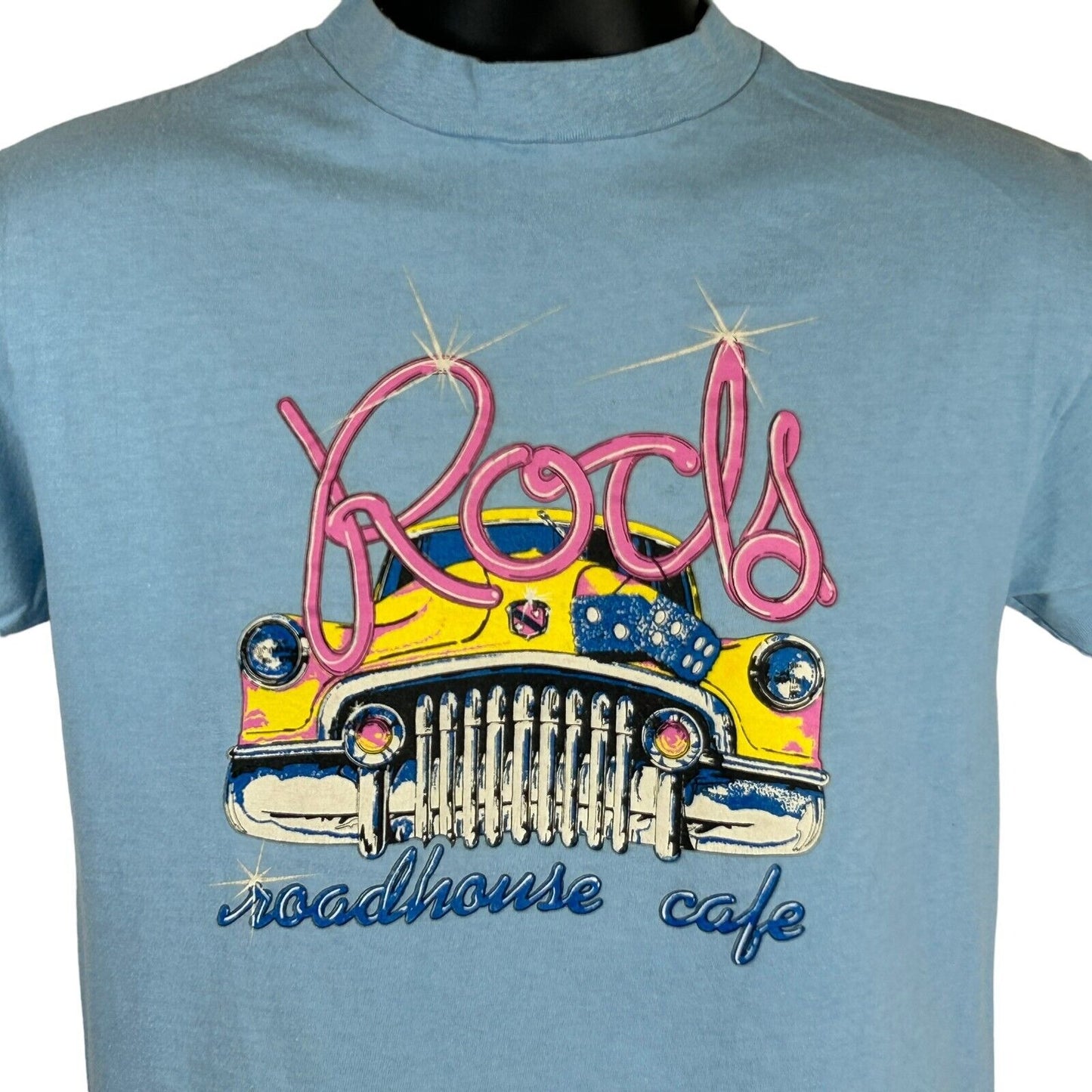 Light blue Hanes T-Shirt featuring Rods Roadhouse Cafe graphic with a vintage yellow car design
