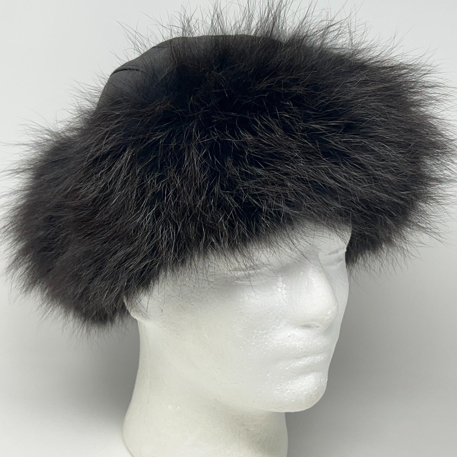 Vintage Roller Hat in black with fluffy fur detail, showcasing a front view on a mannequin head