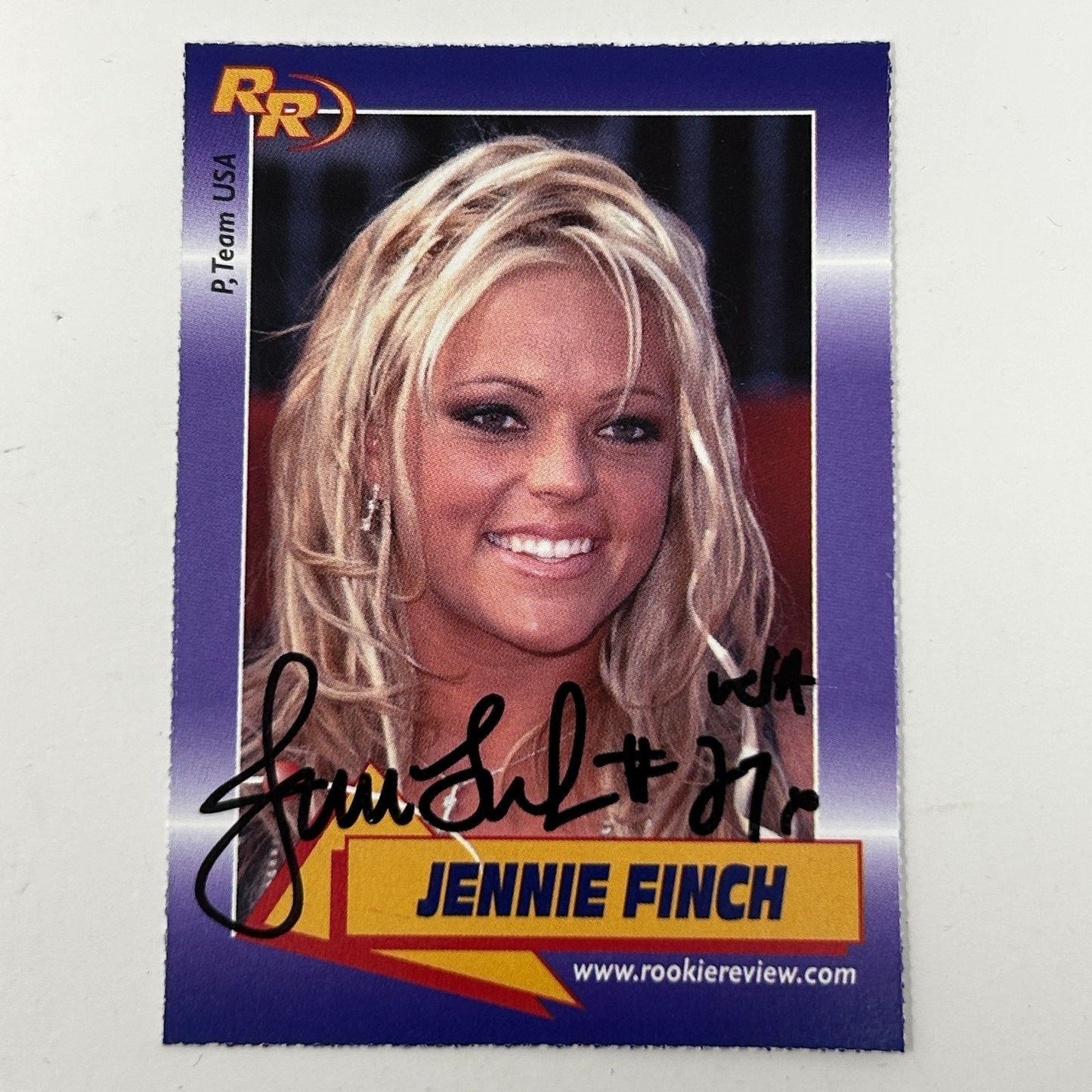 Signed rookie card featuring Jennie Finch, showcasing her portrait with blonde hair and autograph