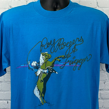 Front view of a blue Roy Rogers T Shirt featuring a cowboy and horse graphic with signature text