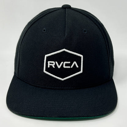 Front view of RVCA black snapback hat with white logo and hexagon design