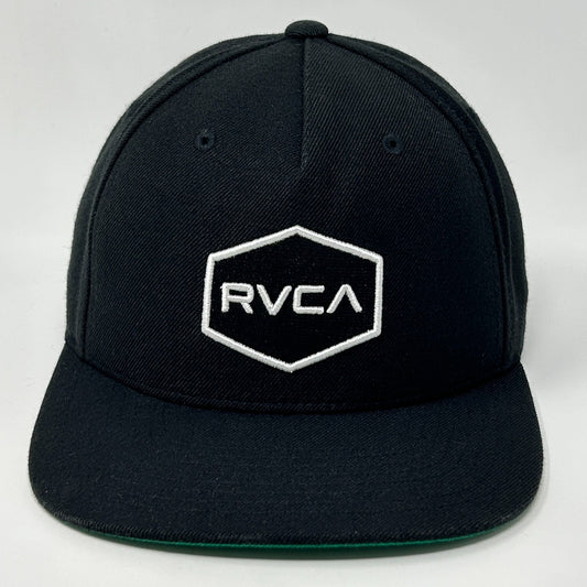Front view of RVCA black snapback hat with white logo and hexagon design