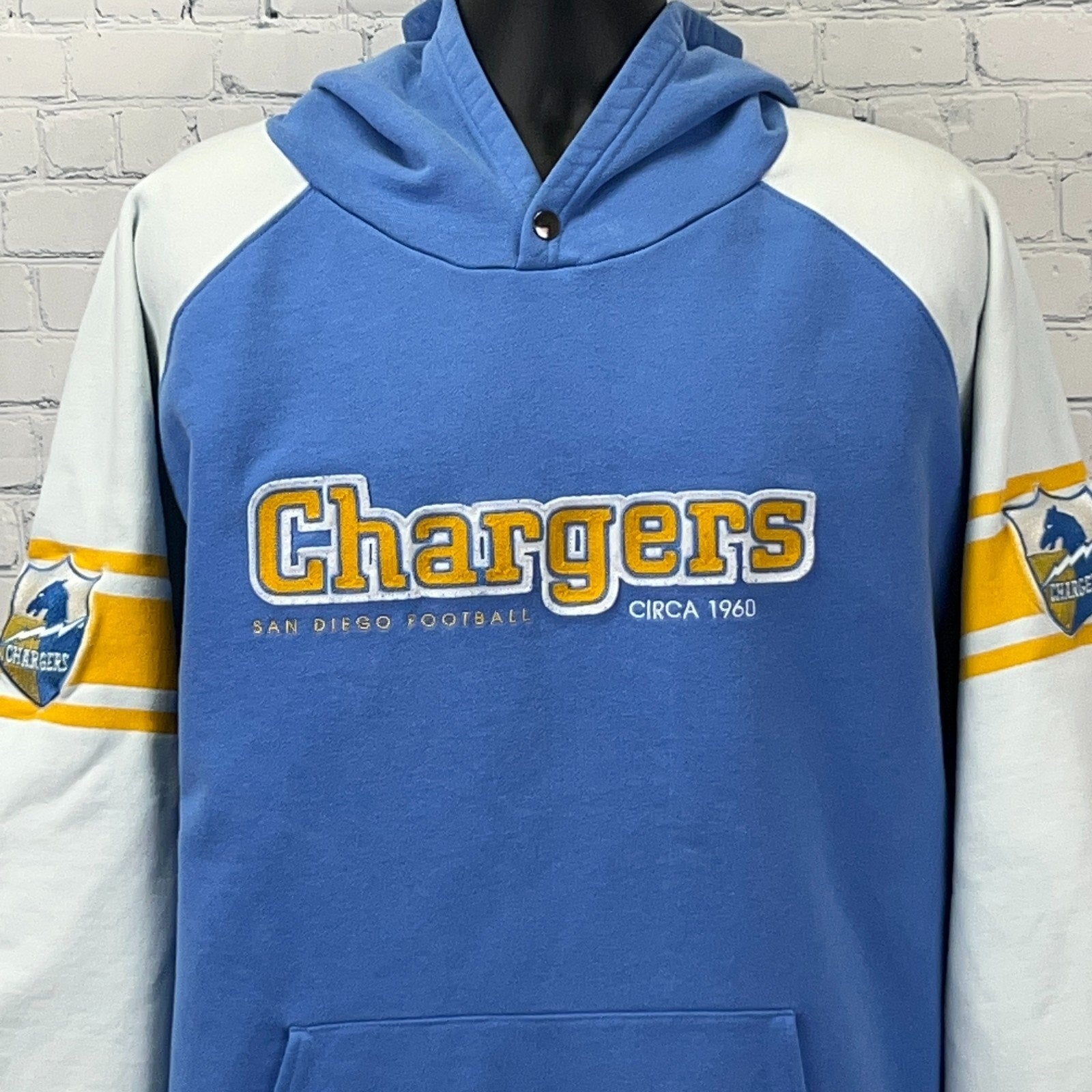 Front view of blue Chargers Hoodie by Reebok, featuring San Diego Football logo and vintage design
