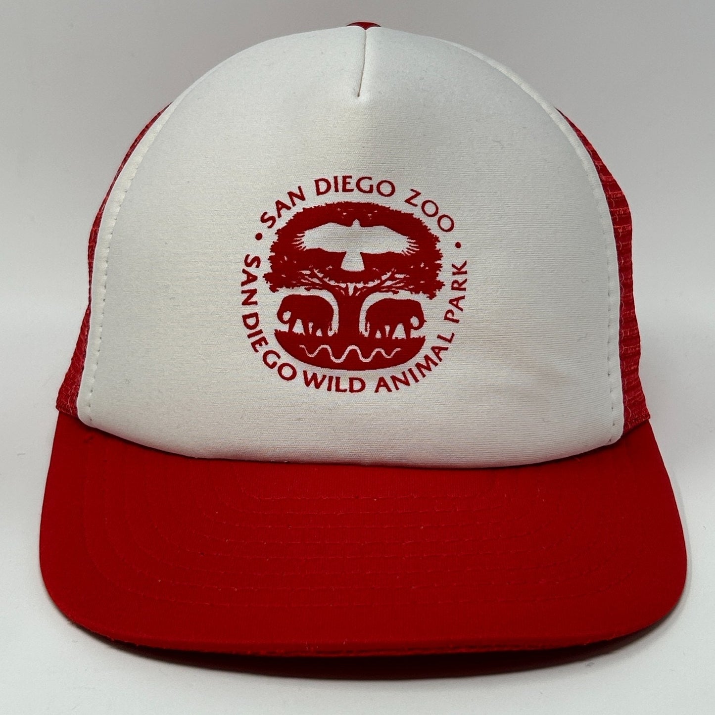 Vintage red and white trucker hat featuring San Diego Zoo logo on the front