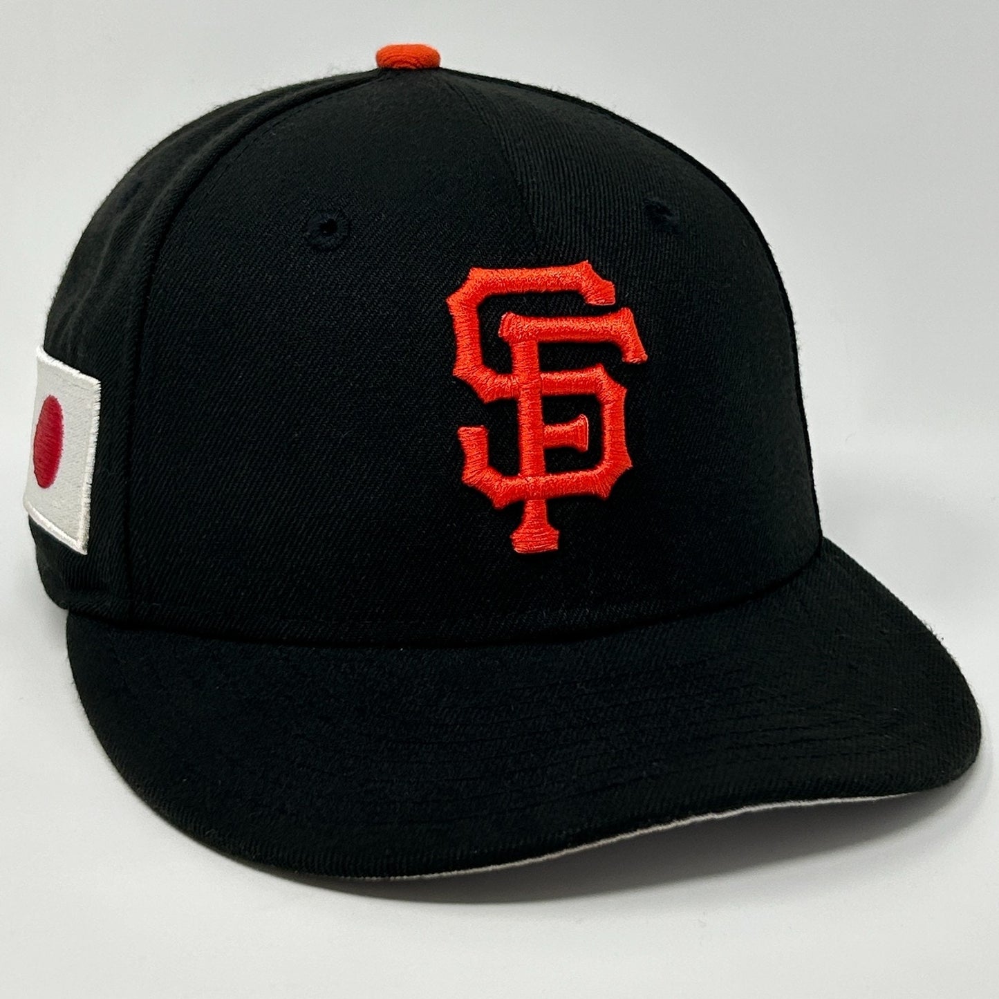 New Era San Francisco Giants Black Baseball Cap with Orange Logo and Side Flag Detail