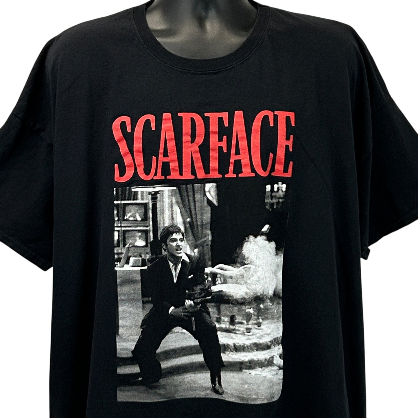 Front view of black boohooMAN Scarface t-shirt featuring a graphic print of a scene from the movie