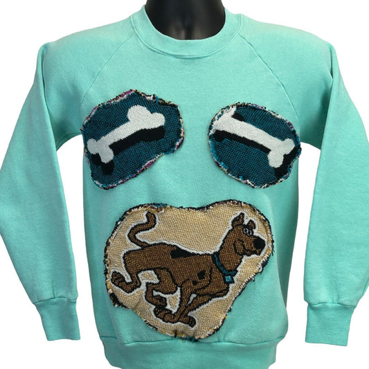 Sky blue Scooby Doo sweatshirt featuring a large Scooby graphic and bone patches on the front