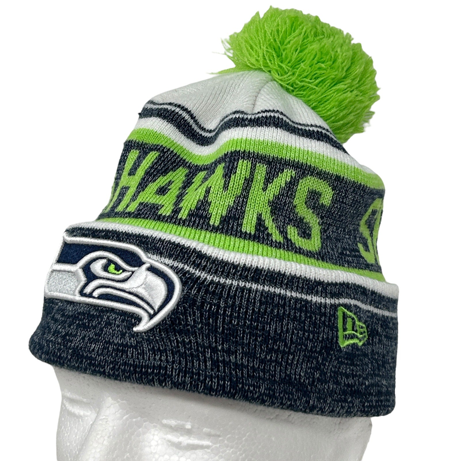 New Era Seahawks beanie in gray and green with pom pom, featuring team logo on the front