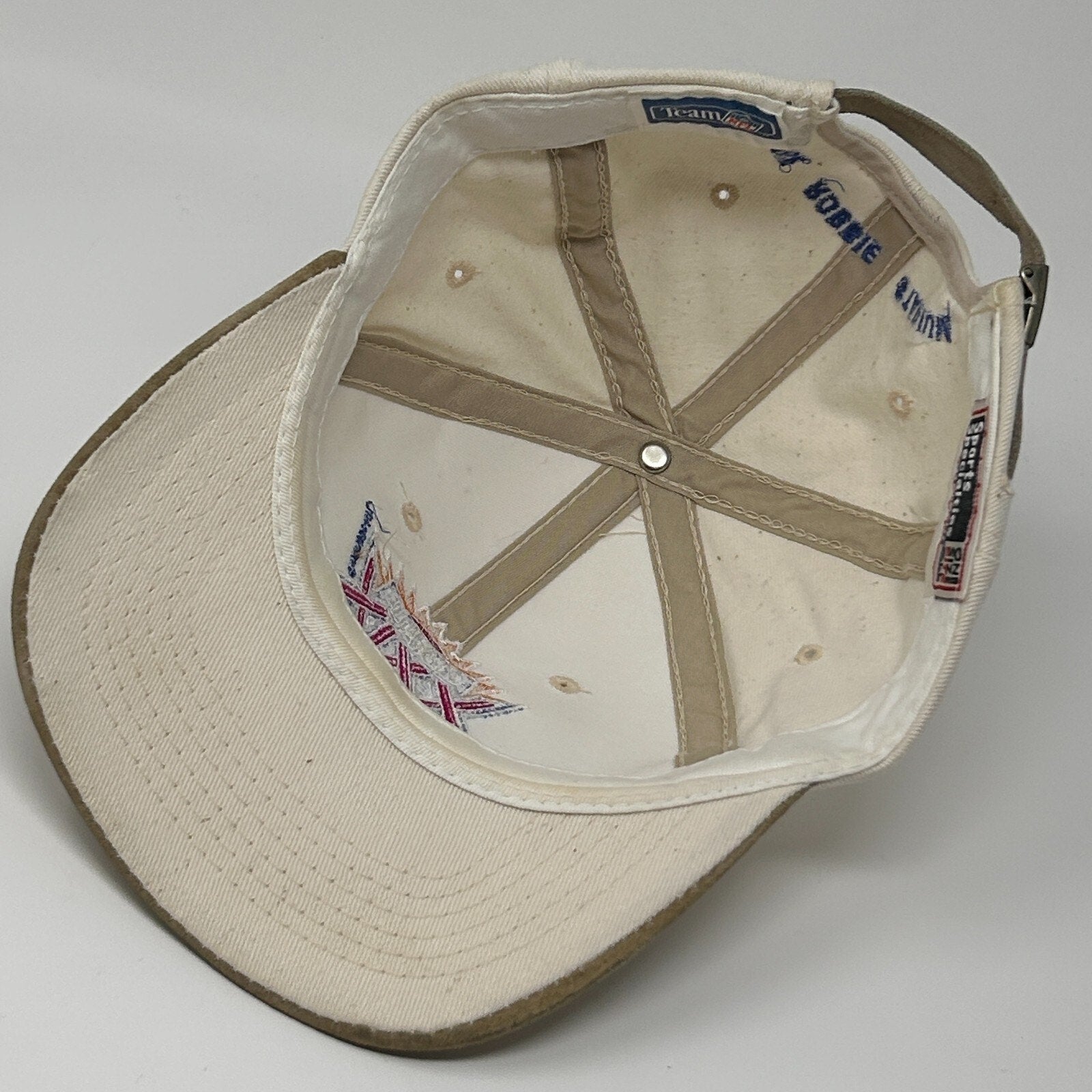 Sports Specialties sf 49ers hat in beige with a curved brim and adjustable strap, top view