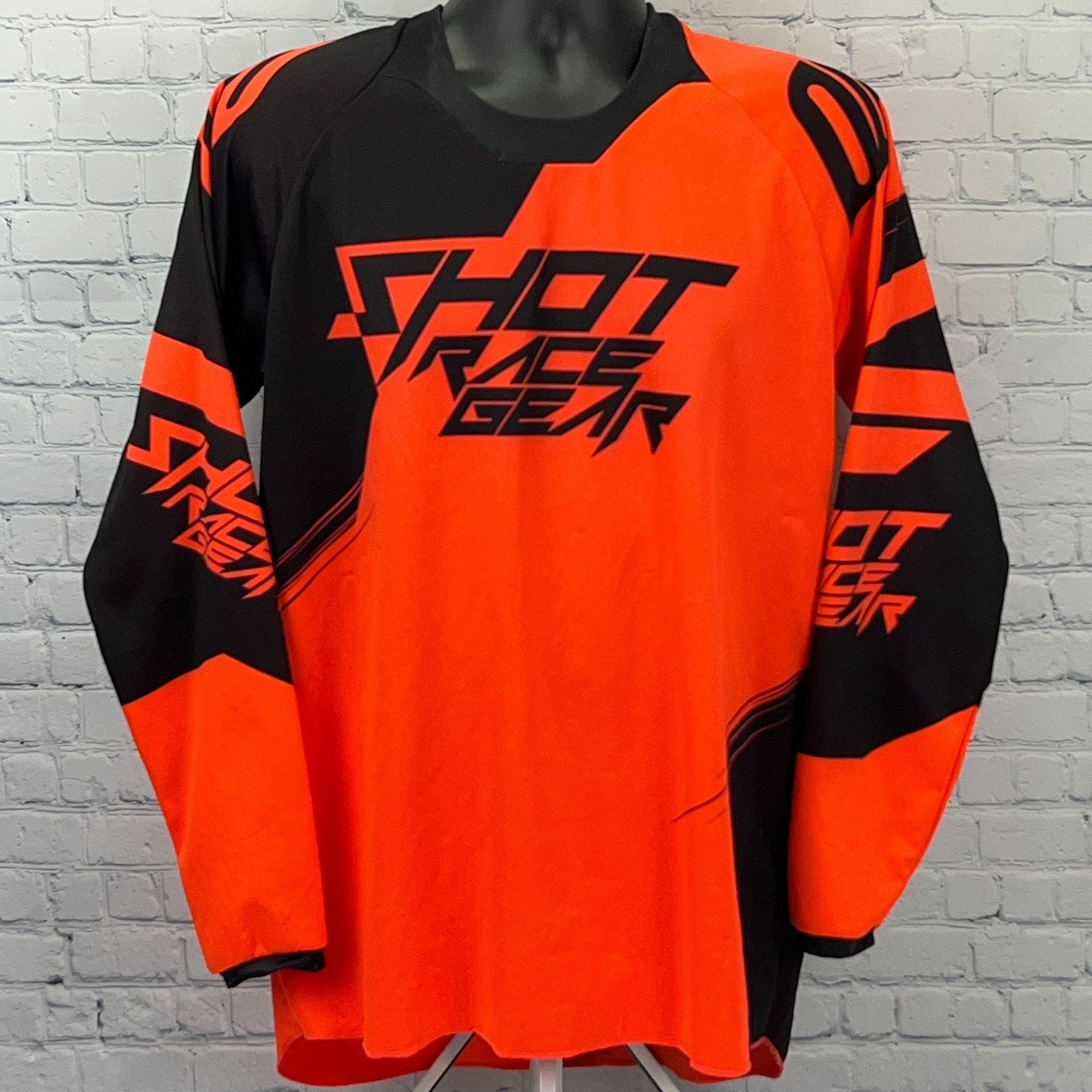 Shot Race Gear Motocross Jersey in vibrant orange and black with bold logo design on front