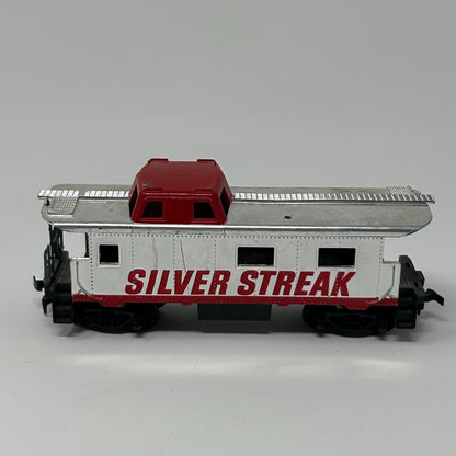 TYCO Caboose in white and red with 'SILVER STREAK' lettering, side view showing roof and wheels