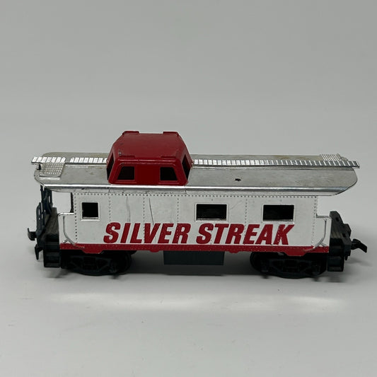 TYCO Caboose in white and red with 'SILVER STREAK' lettering, side view showing roof and wheels