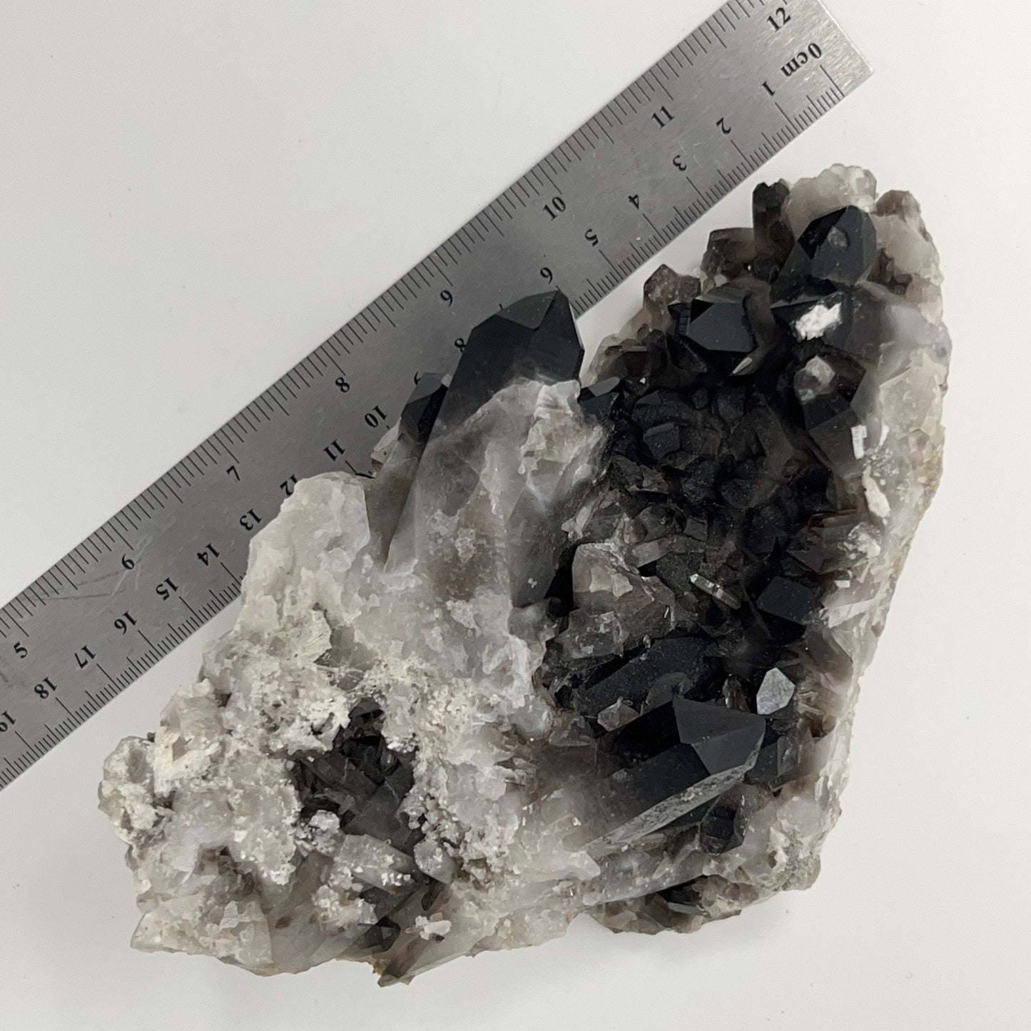 Unbranded vintage smoky quartz crystal specimen with black and gray hues, measuring approximately 10 cm