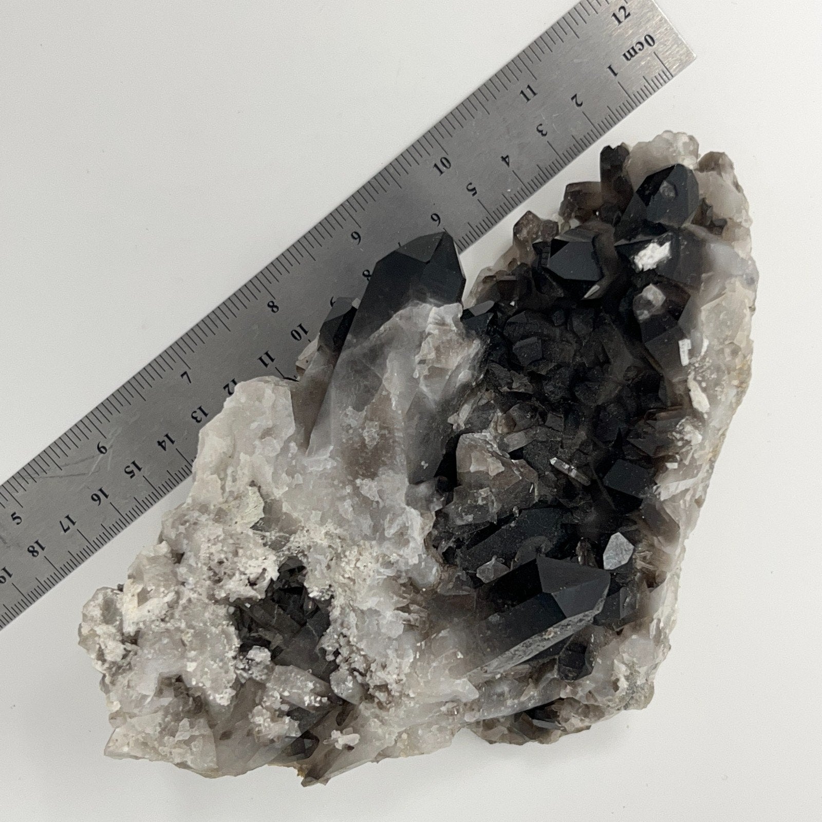 Unbranded vintage smoky quartz crystal specimen with black and gray hues, measuring approximately 10 cm
