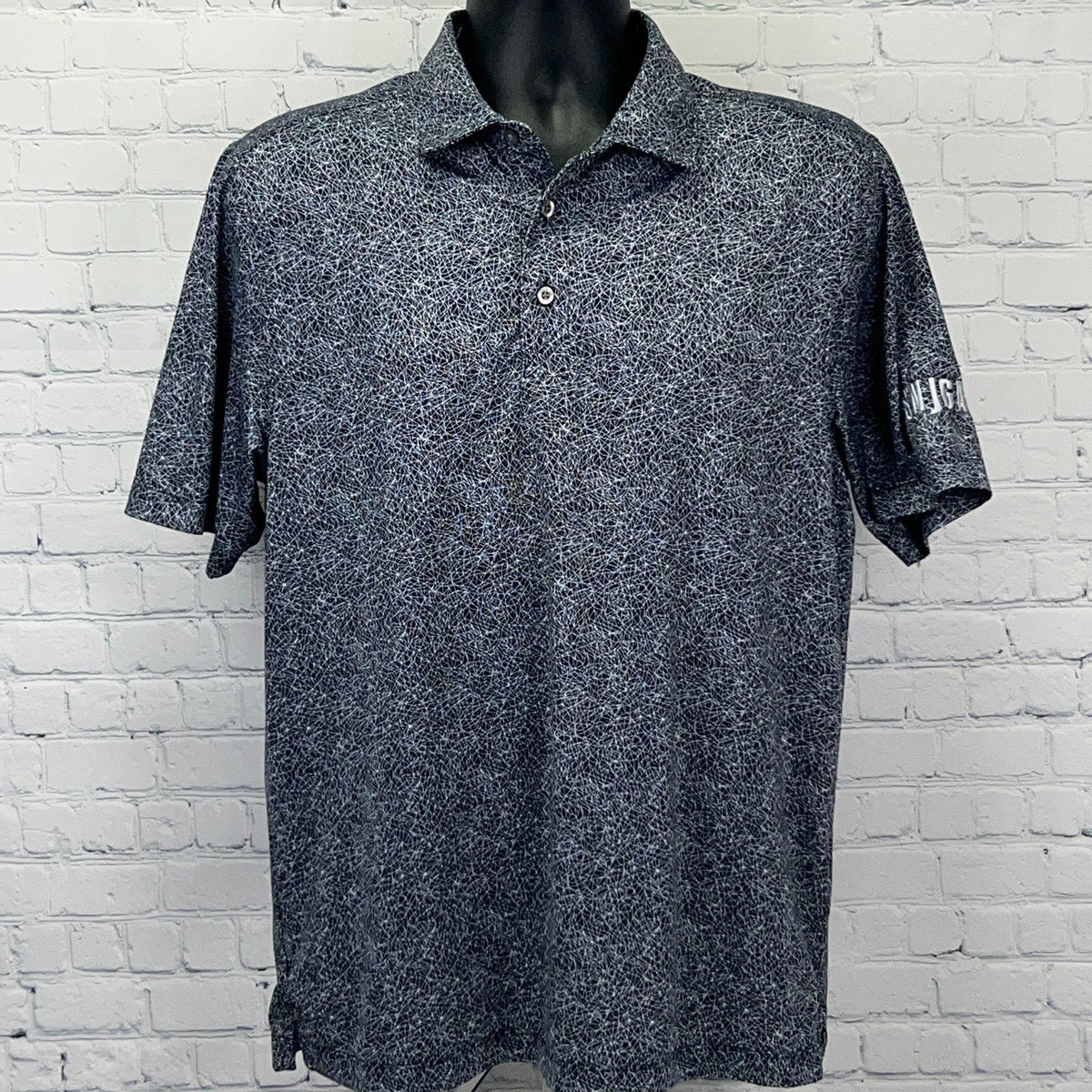 Cutter & Buck SNJGA Short Sleeve Polo Shirt in Black with a unique pattern for casual wear