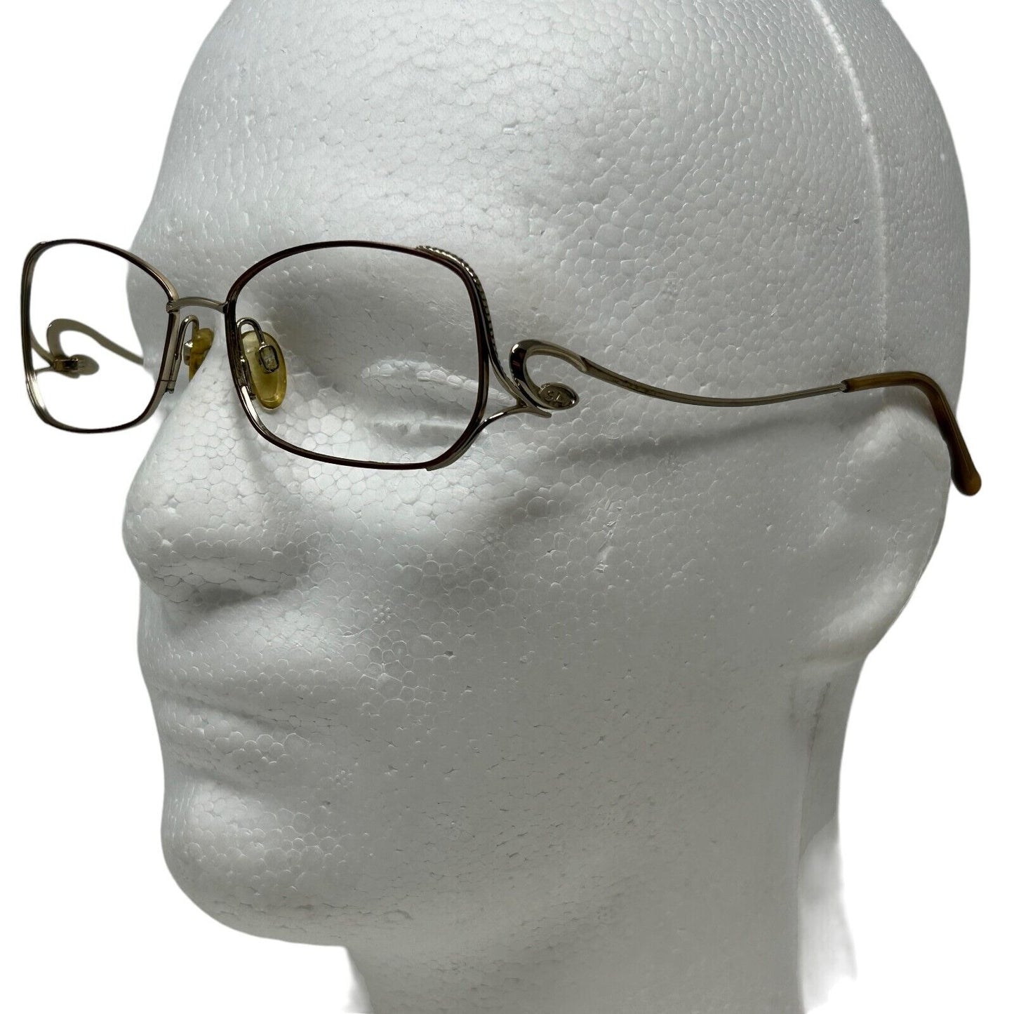 Sophia Loren Eyeglasses in gold with rectangular frames, side view showcasing the unique design